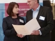 IOI Secretary General Kräuter congratulates Emily Logan on her new position