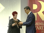 Arman Tatoyan (right) receives PR award