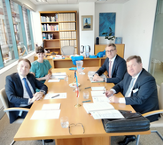 from left to right: IOI President Field, Ms Rebecca Poole, Mr Meinhard Friedl and IOI Secretary General Amon 