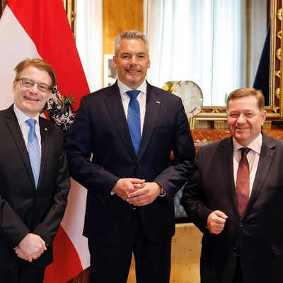 Courtesy visit to the Federal Chancellor H.E. Karl Nehammer with the IOI President Chris Field and the IOI General Secretary Werner Amon