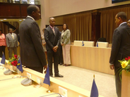 Mr. Concincion (far right) is sworn in by the President of the Parliament