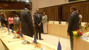 Mr. Concincion (far right) is sworn in by the President of the Parliament