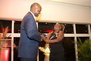 Dr. Nilda Arduin recives Royal Decoration from Governor Eugene Holiday.