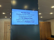 Welcome message to IOI President, Chris Field PSM, and Chief of Staff to the IOI President, Rebecca Poole, displayed at the entrance of Postojna Cave