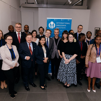 Photo with staff members present at the Board Meeting