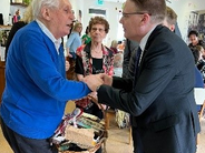 IOI President, Chris Field PSM, with a member of the day care centre, Hiša dobre volje, at the Nova Gorica Home for the Elderly.