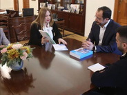 Commissioner Styliano-Lottides handing the reports to President Christodoulides
